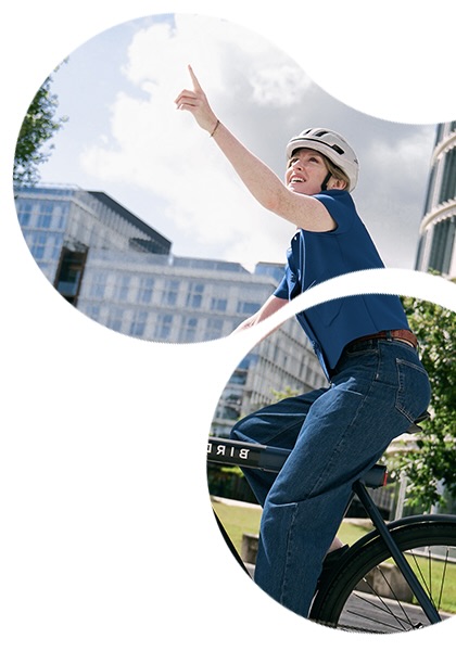 Grafisch gestaltetes Bild mit zwei organisch geformten Ausschnitten: eine Frau mit Fahrradhelm sitzt auf einem Fahrrad und zeigt nach oben, im Hintergrund sind moderne Gebäude und Himmel zu sehen.
