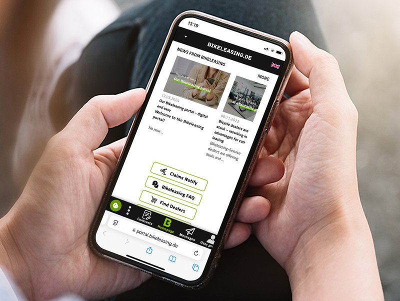 Hands holding iPhone showing Bikeleasing portal